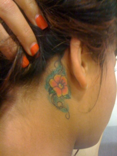 Flower Tattoo Across Back. tattooed across her ack,